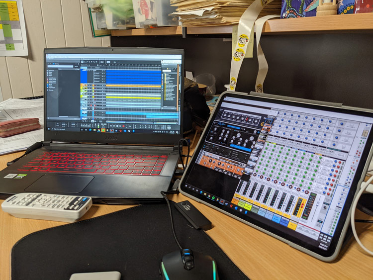 The studio: a laptop and a tablet running music software
